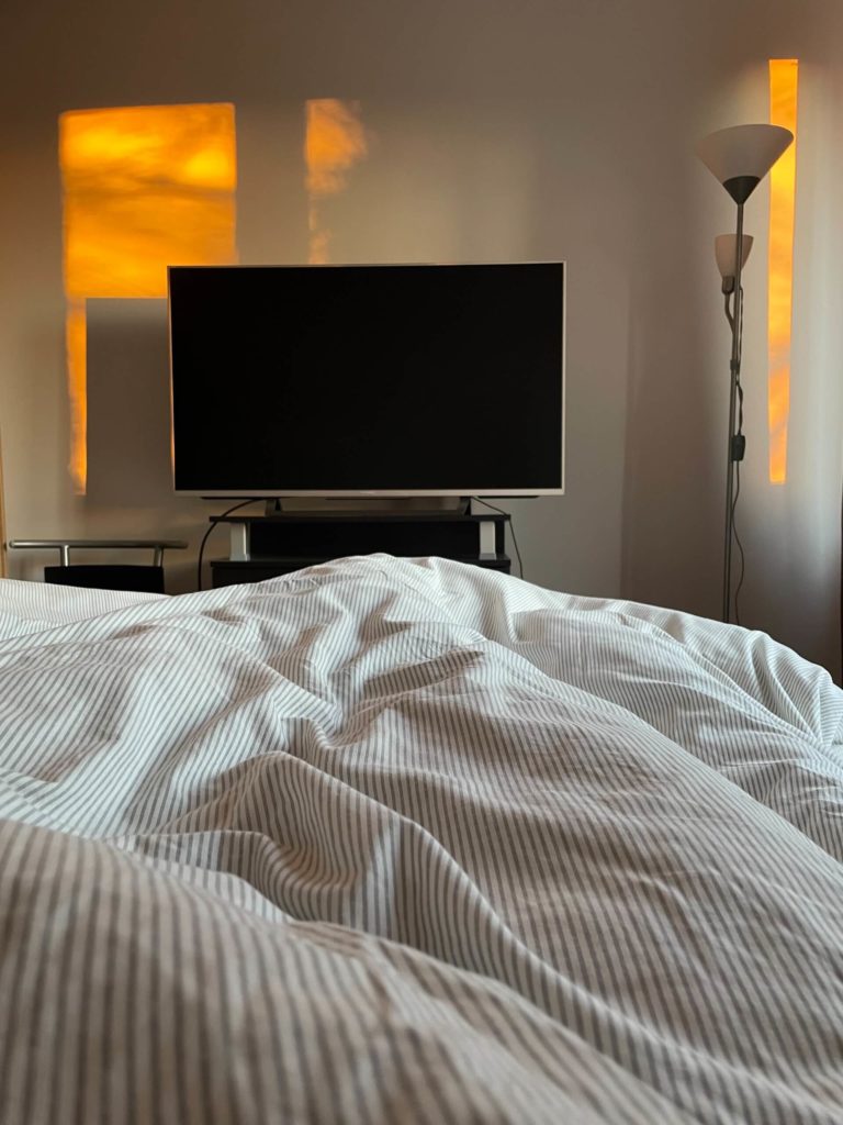 The TV is the most important thing you should get rid of to have a minimalist bedroom.